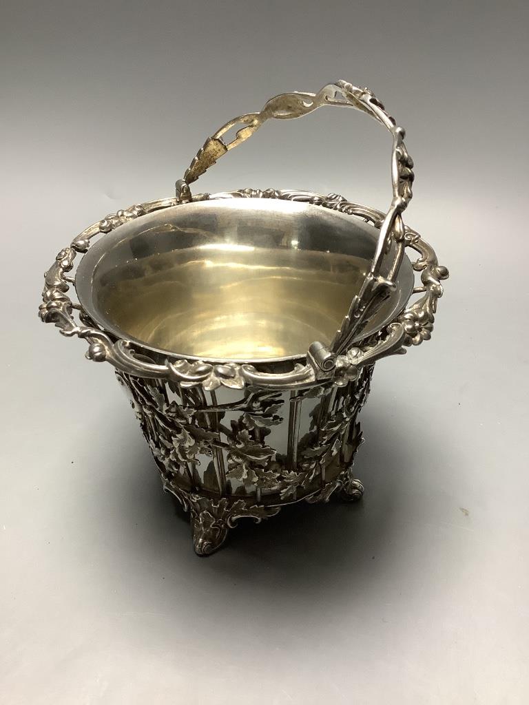 An early Victorian pierced silver sugar basket by the Barnards, London 1846, now with a later silver liner, London 1914, 12.5oz.